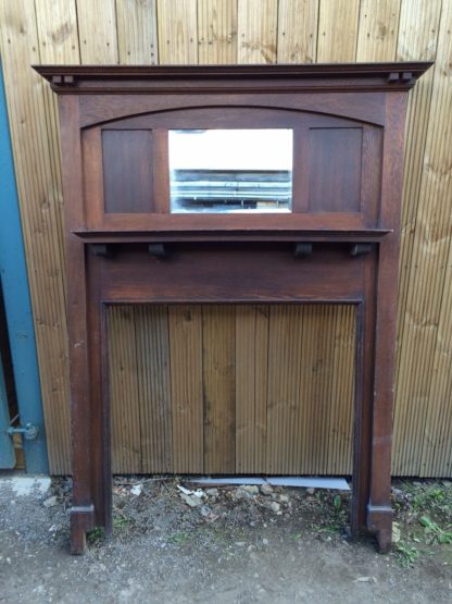 wooden mantle with mirror